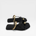 Sandalias negra y dorada - Bryan Stepwise